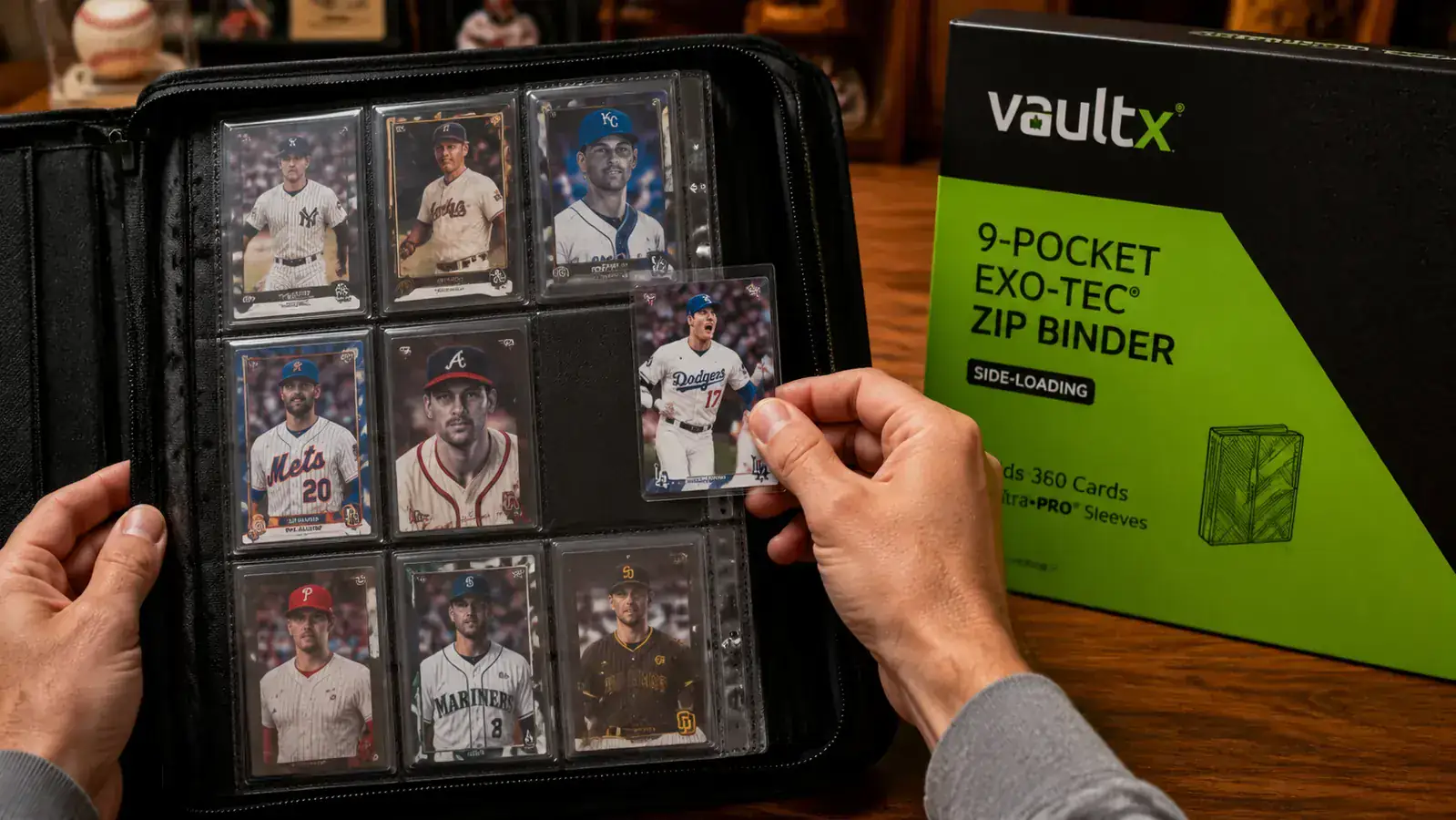 Close-up of a side-loading binder page with baseball cards inserted, showing the side-entry slot preventing cards from slipping out